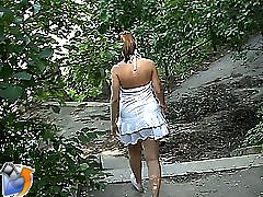 Unsuspecting slut gets undressed on the streets